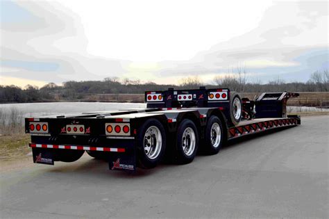 Xl specialized trailers - A trailer revolutionizing the hauling industry with its innovative sliding axle assembly. With a 17-degree load angle and versatile lengths. Equipped with a 20,000 lb winch and user-friendly features like a wireless remote, hauling has never been easier. Say goodbye to unnecessary wear with its extended dump angle and hydraulic assembly. Upgrade to the …